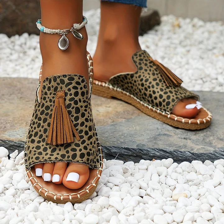 Casual colorful sandals with comfortable footbed shown on a plain background.