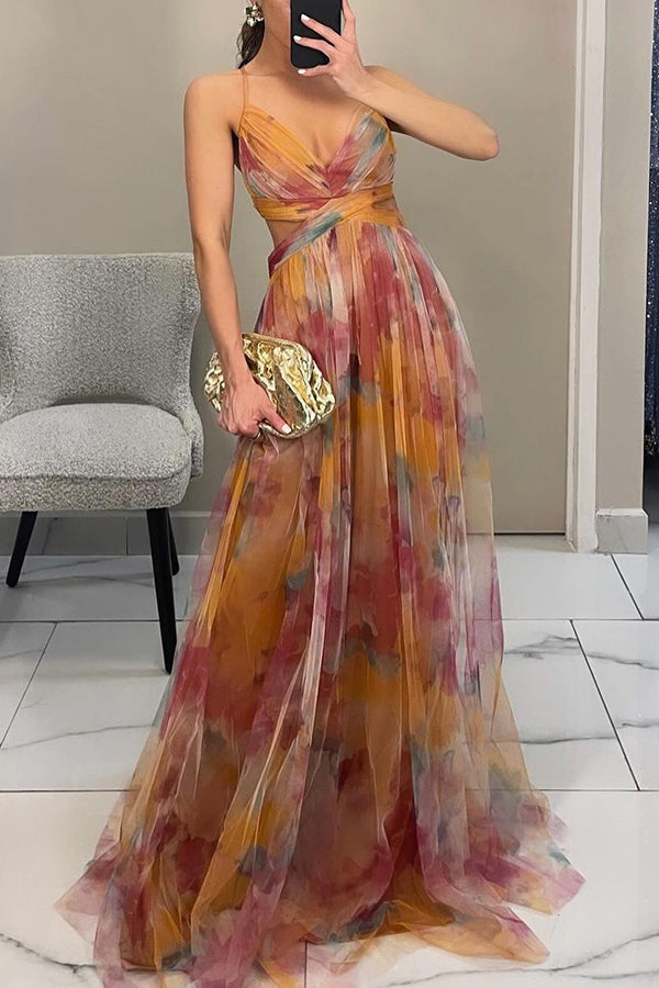 Model wearing a soft draped maxi dress against a plain background.