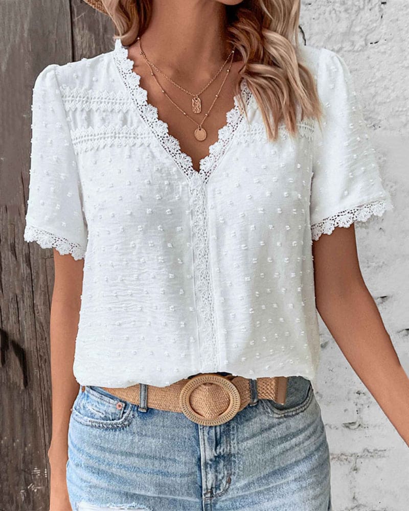 Woman modeling a vintage-inspired blouse, front view