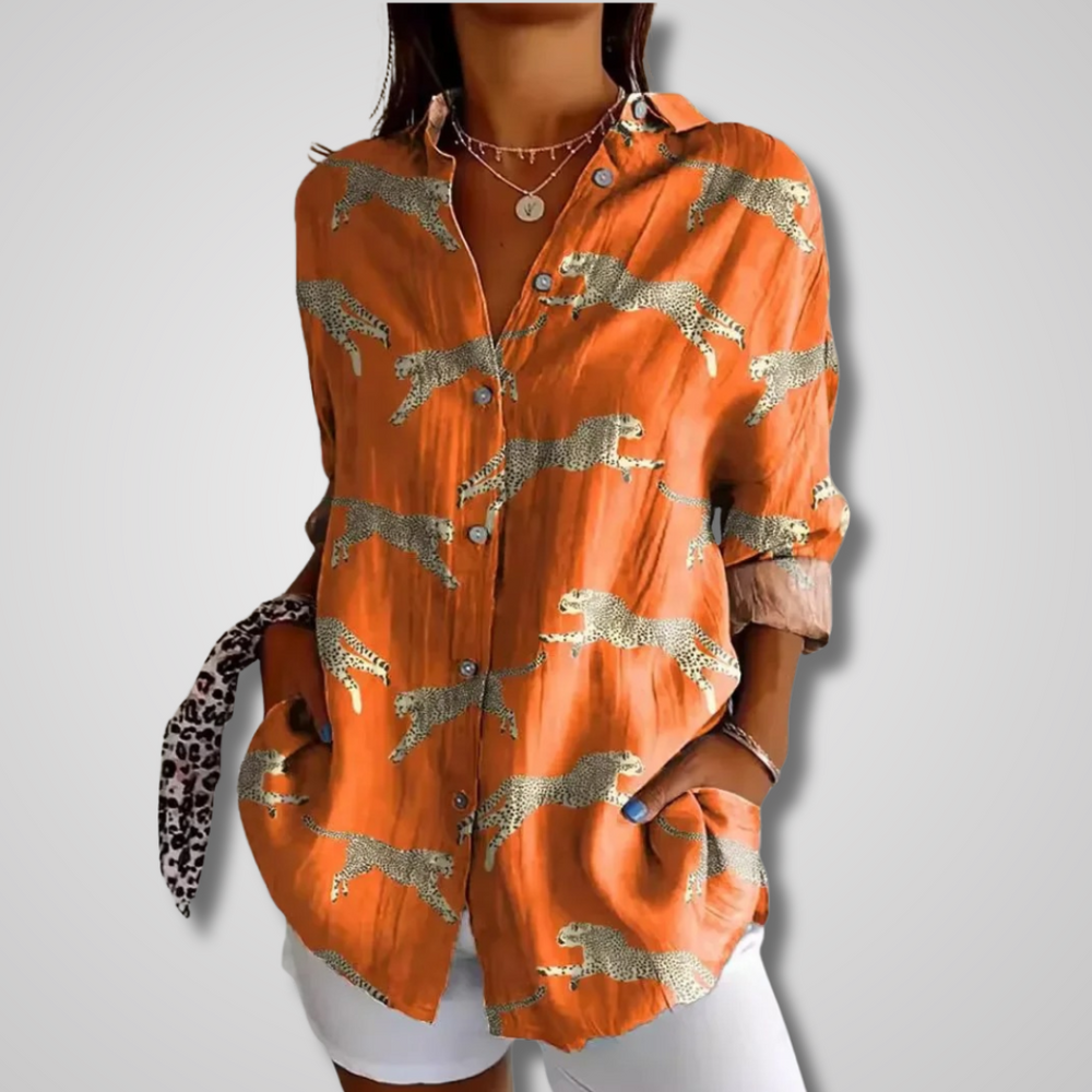 Flowy retro-style women’s shirt w/ model on a clean background.