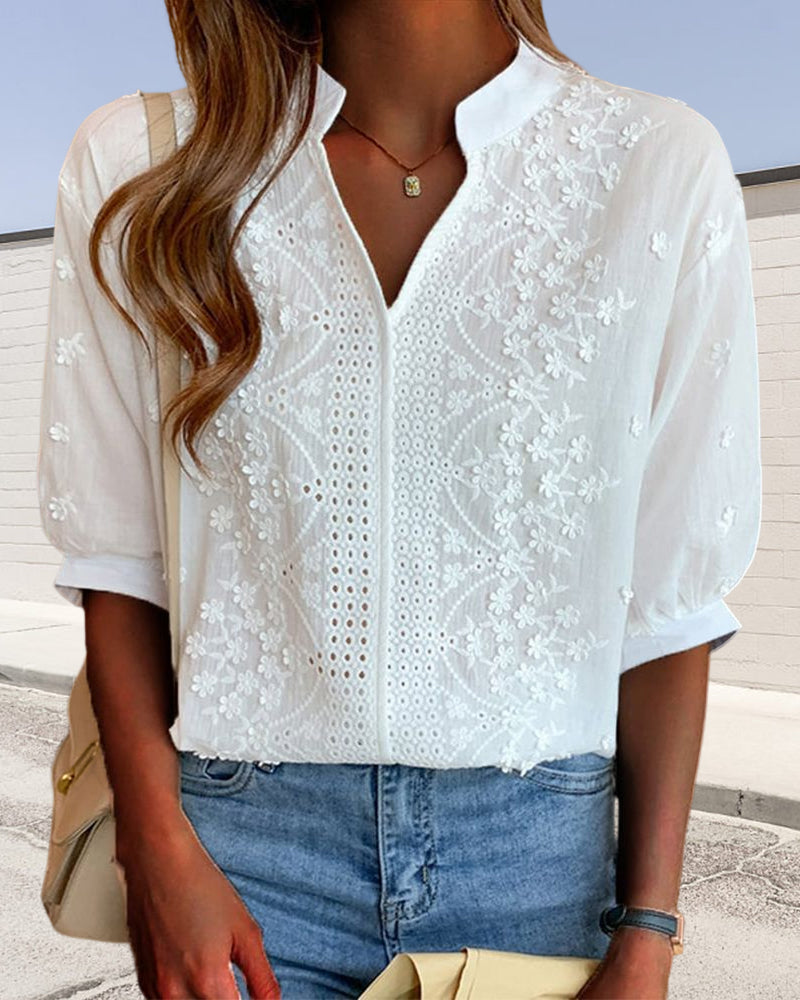 Full front display of romantic blouse on plain white background.