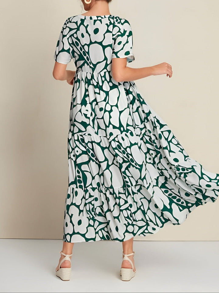 Woman wearing a soft draped summer dress in back angle view
