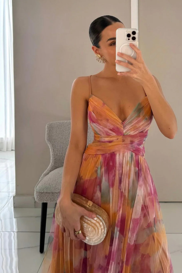 Female model wearing a lightweight maxi dress in a clean studio setting.