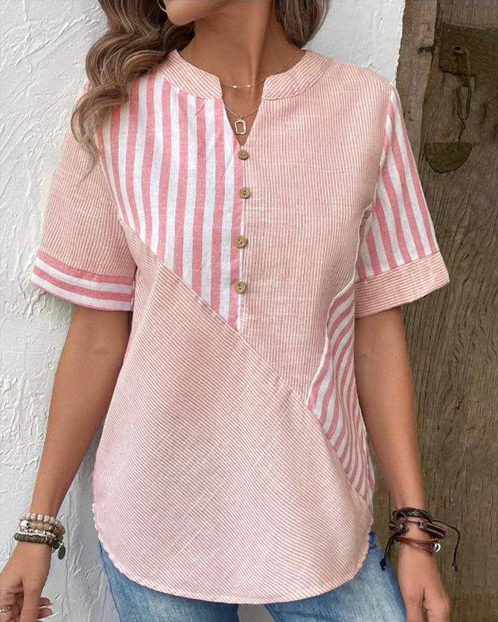 Relaxed fit striped blouse shown with a wearer against a clean background.