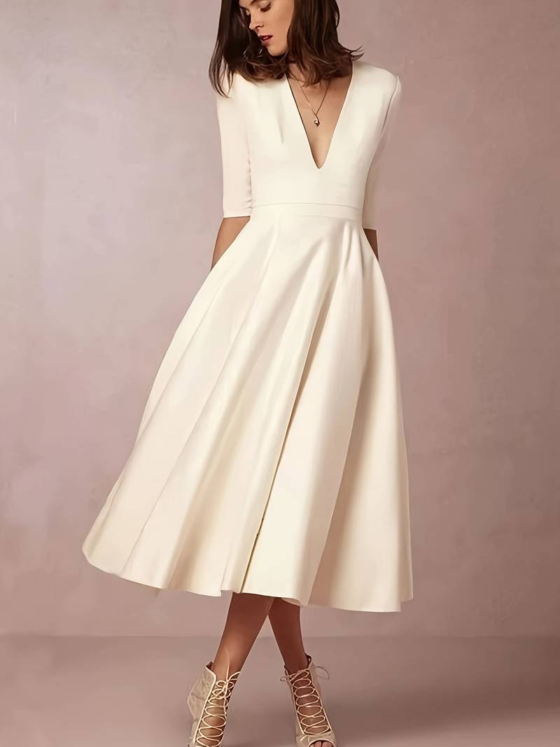 Female model front view elegant midi dress indoor living space
