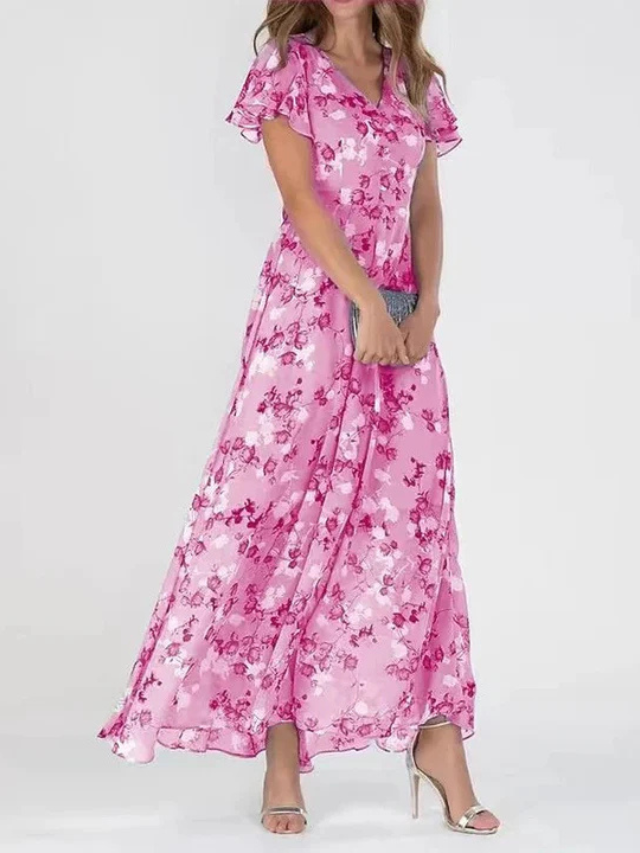 Female model wearing a sophisticated occasion dress against a clean background.
