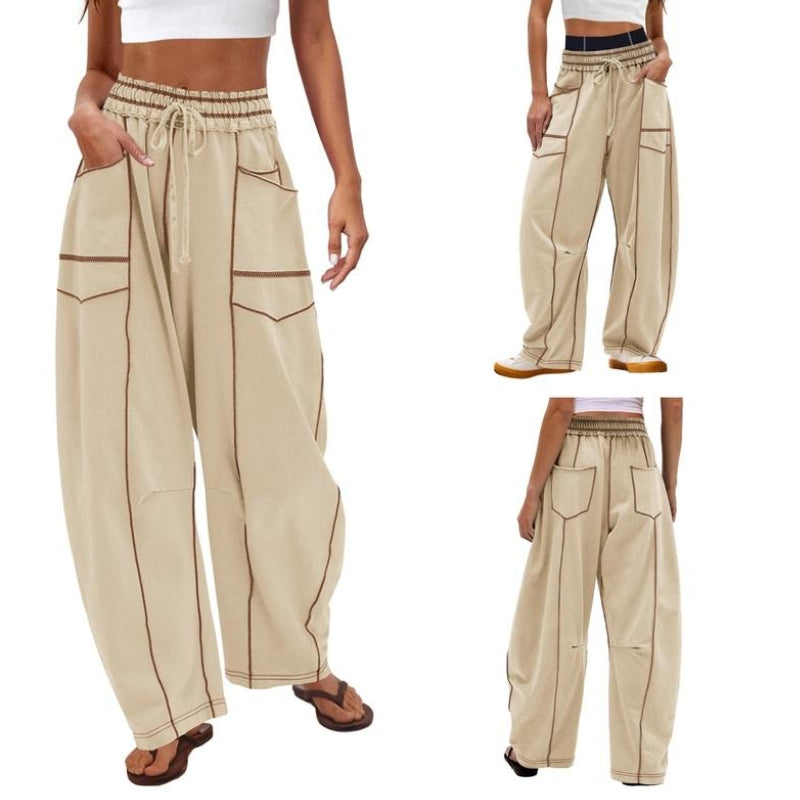 Woman styled in high-rise wide-leg cargo pants against a plain background.