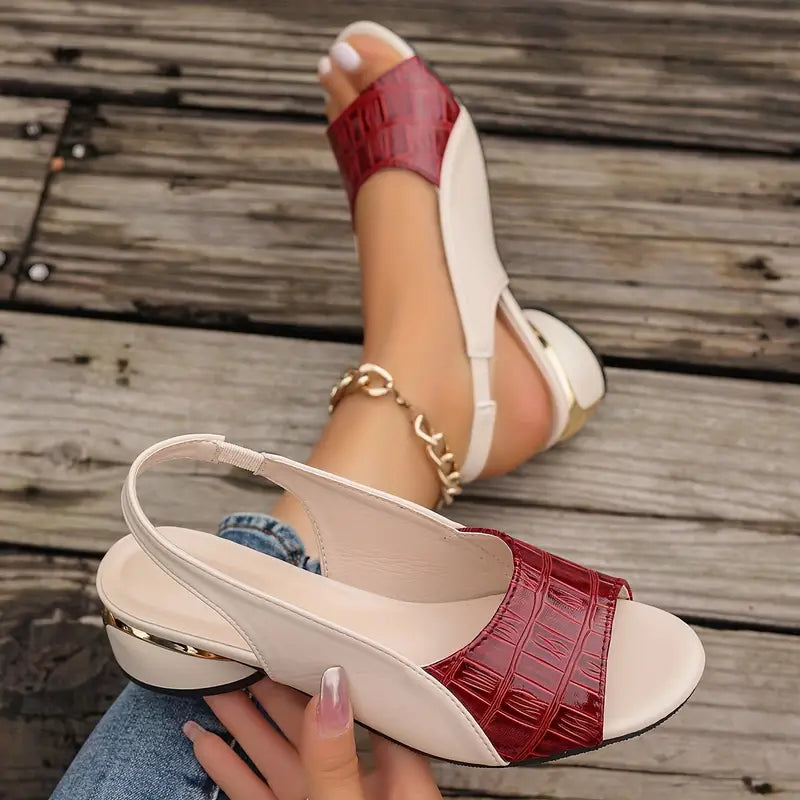 Foot shown wearing comfortable neutral block heel sandal on clean background.