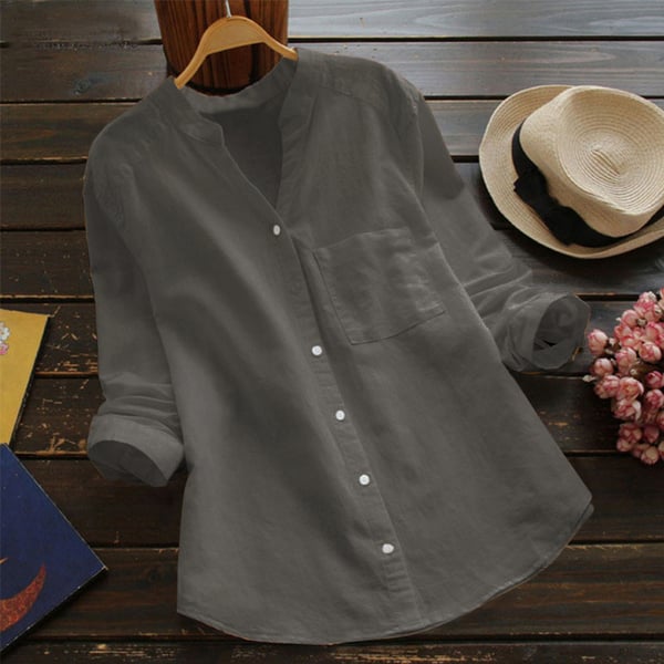 Loose fit women’s shirt front angle on plain background.