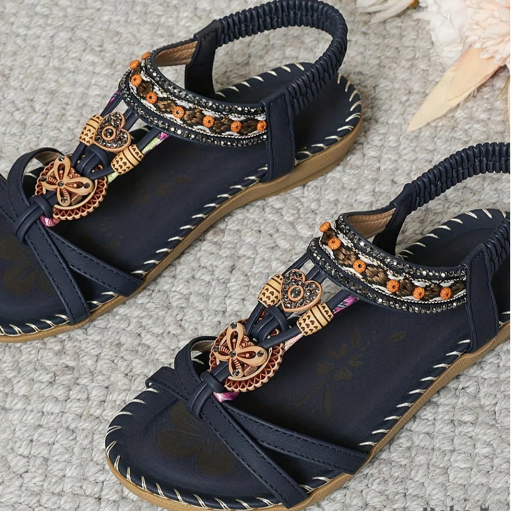 Stylish beach sandals on a plain background