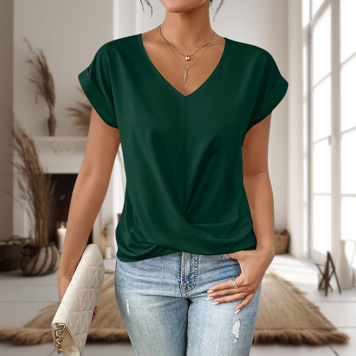 Stylish women’s short sleeve top displayed on a model with a clean background.