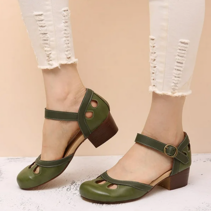 Model wearing supportive women’s sandal with cushioned insole on clean background.