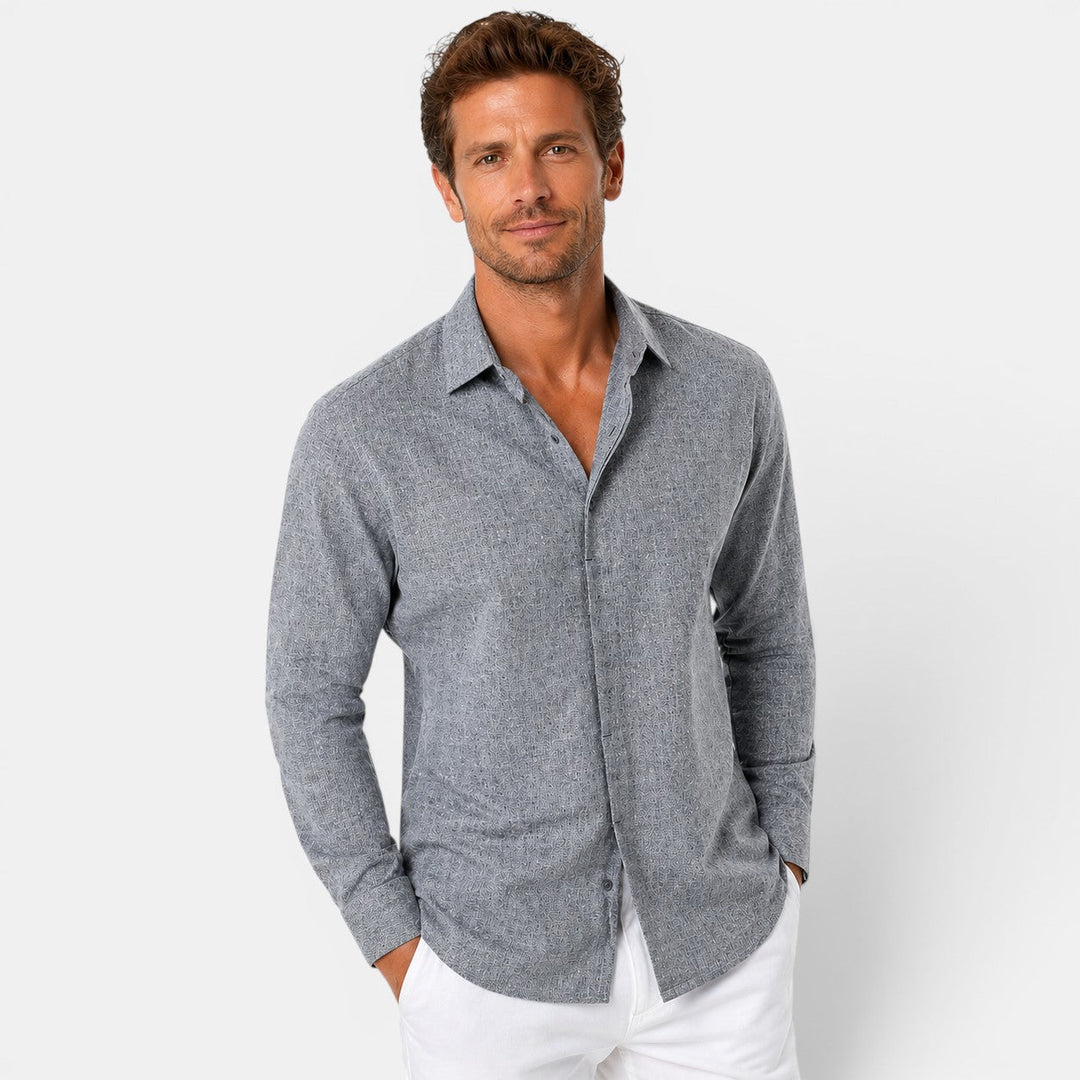 Male model wearing a lightweight linen shirt on a plain background.