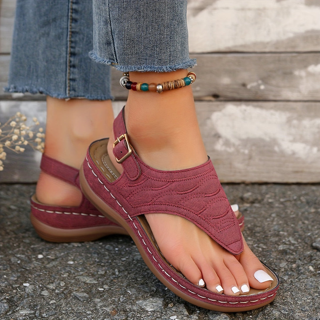 Clip toe sandals displayed on a plain background.