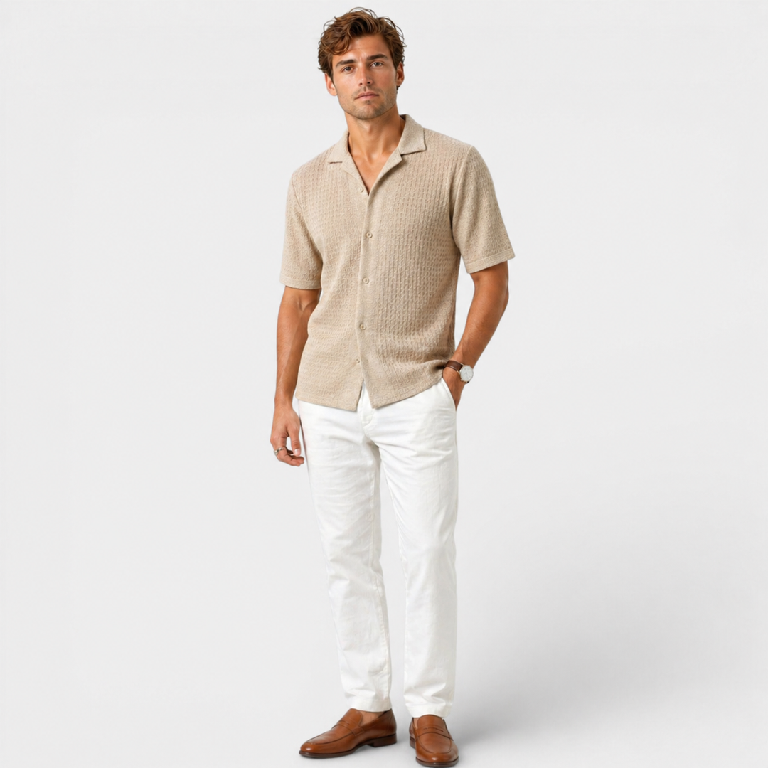  Male model styling a breathable summer shirt with a clean smart casual look.ear.