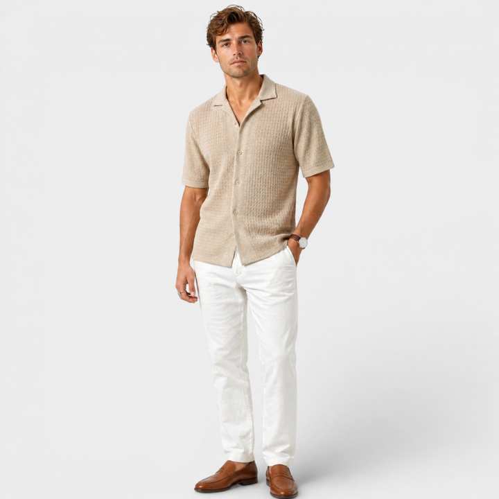  Male model styling a breathable summer shirt with a clean smart casual look.ear.