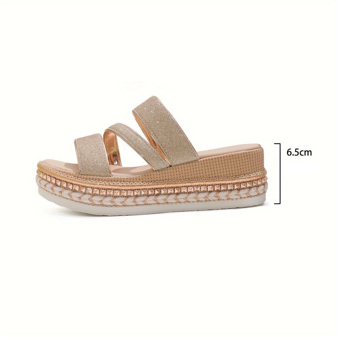 Model feet shown in chic metallic sandals on a clean background.