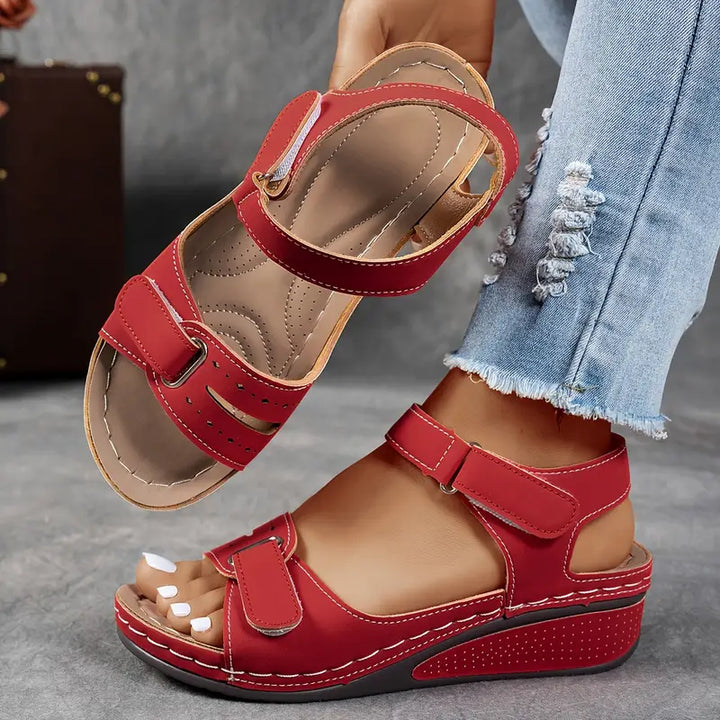 Foot wearing lightweight wedge sandal with cushioned sole.