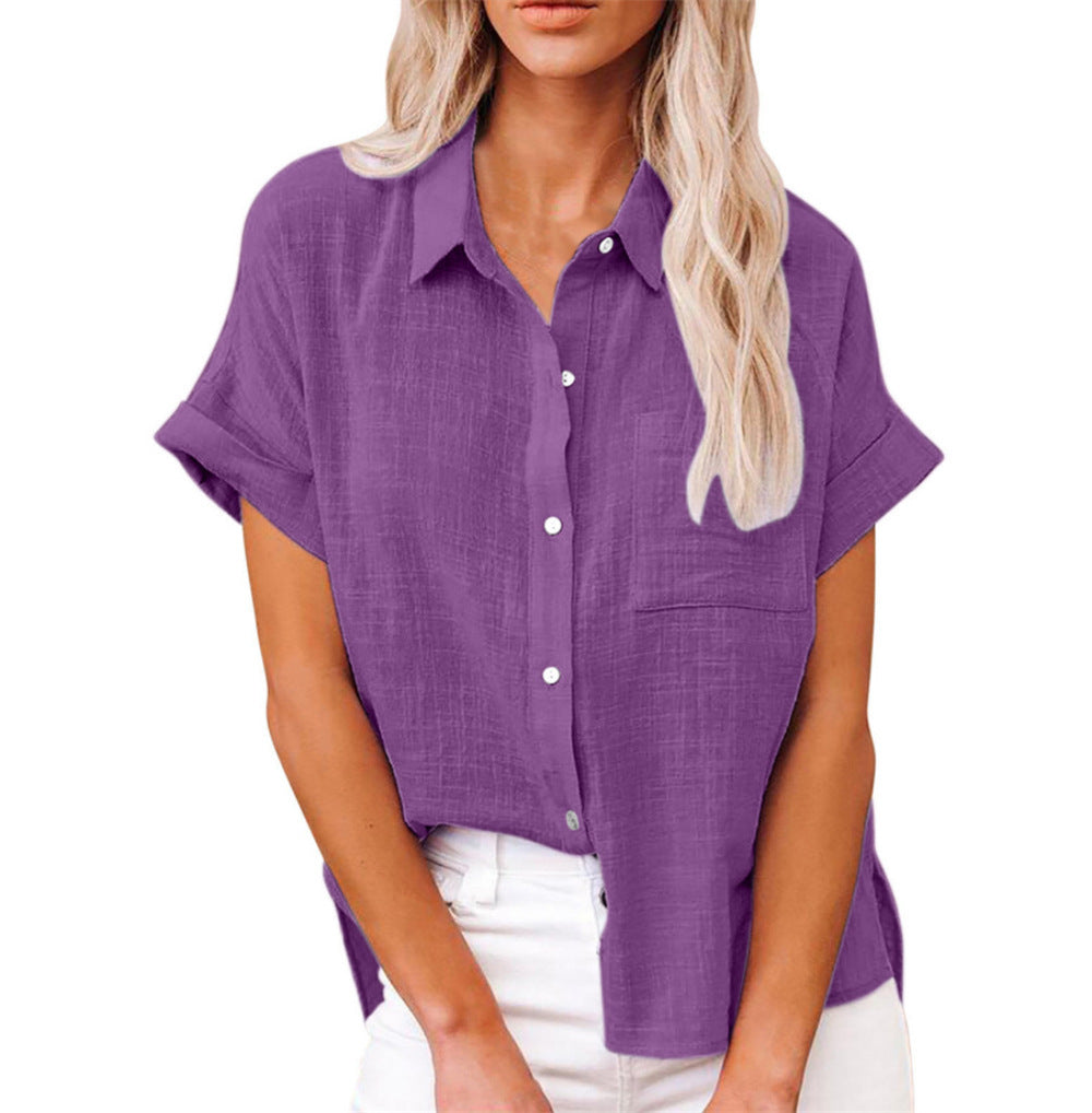 Woman wearing a soft airy shirt with polished everyday look against a plain background.