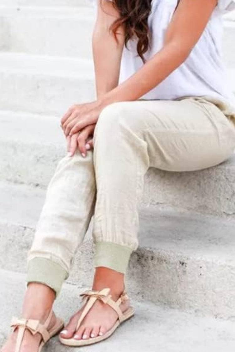 Casual ankle pants displayed on a plain background with relaxed tapered legs.