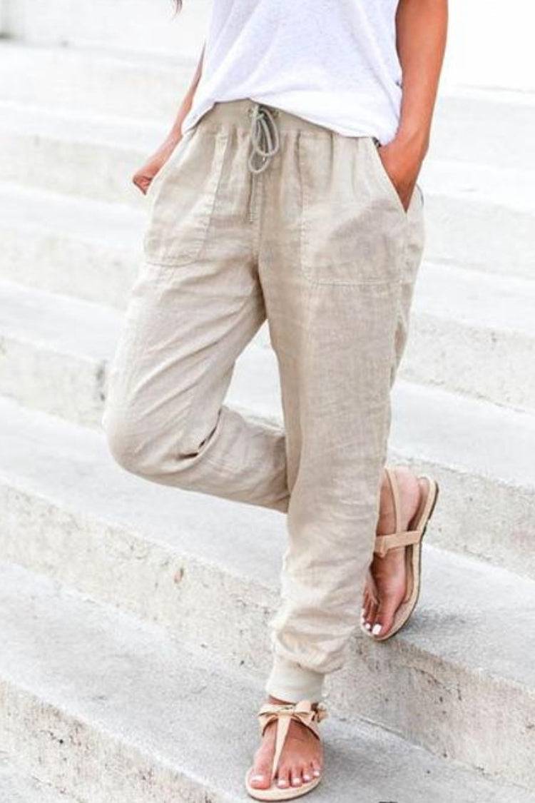 Female model wearing relaxed ankle cuff pants for everyday casual outfits.