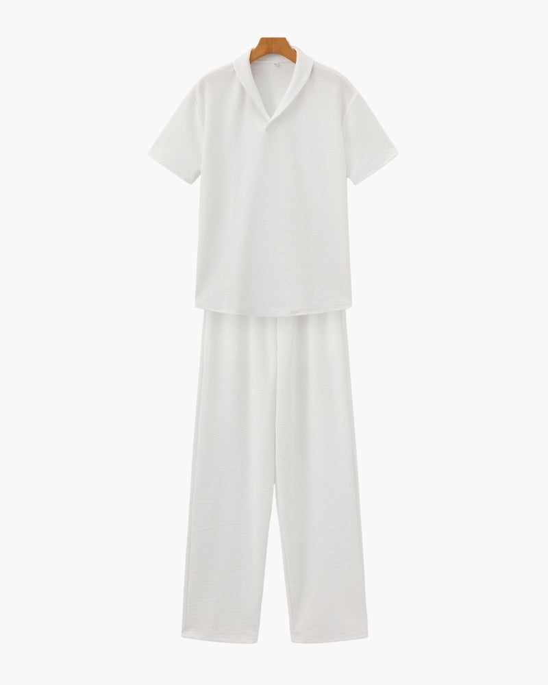 A coordinated casual shirt and pants set against a plain background.