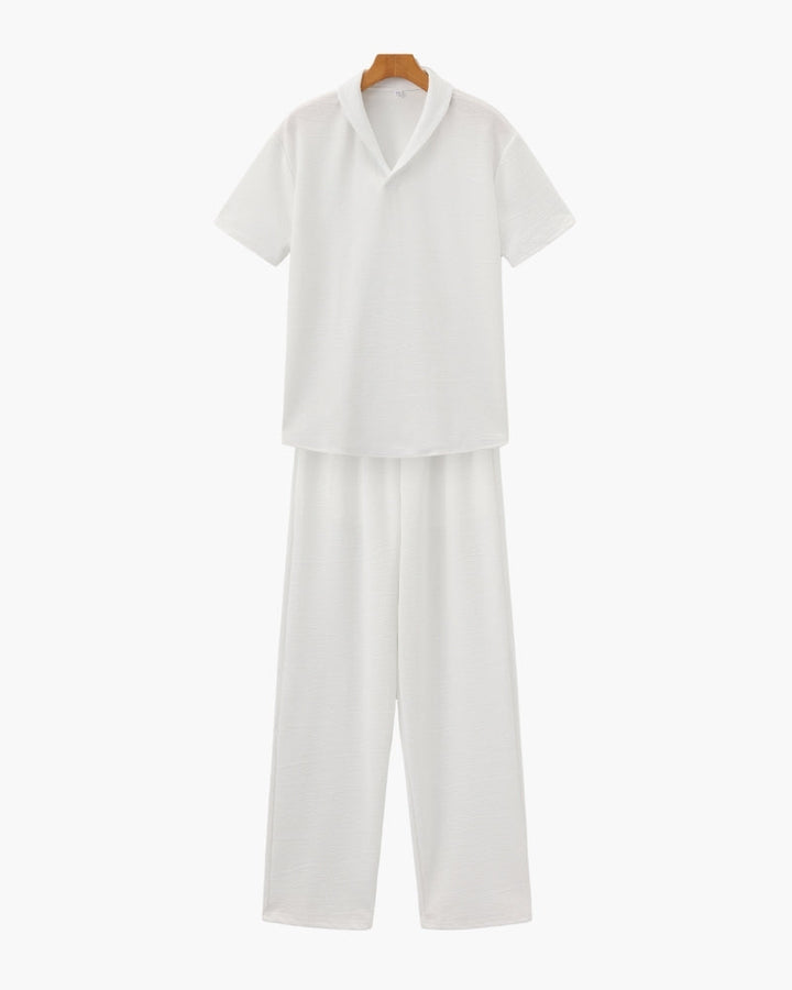 A coordinated casual shirt and pants set against a plain background.