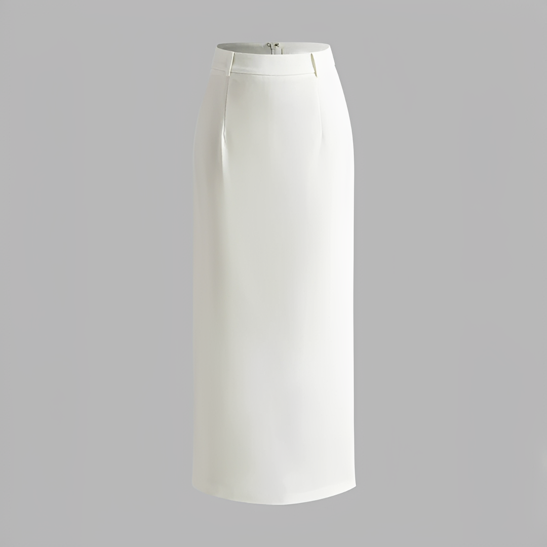 A maxi skirt styled with a tucked-in blouse on a plain background.