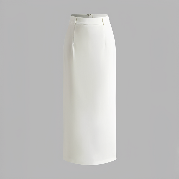 A maxi skirt styled with a tucked-in blouse on a plain background.