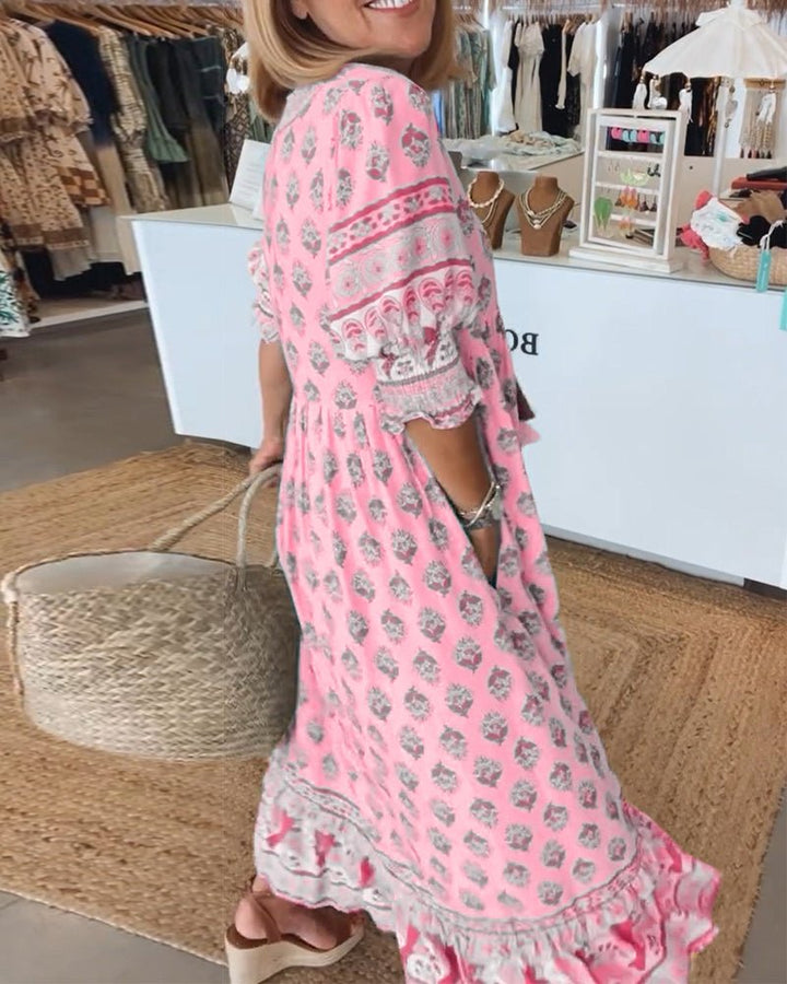 Loose boho midi dress shown on a plain background with easy movement and relaxed style.