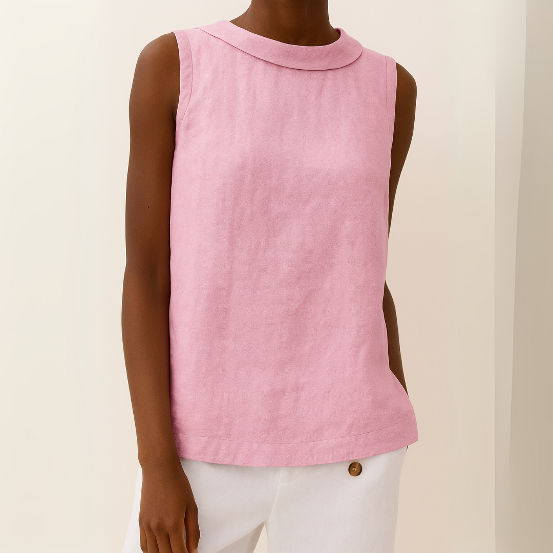 Flattering women’s sleeveless drape fit top displayed on a person with a plain background.