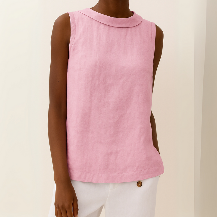 Flattering women’s sleeveless drape fit top displayed on a person with a plain background.