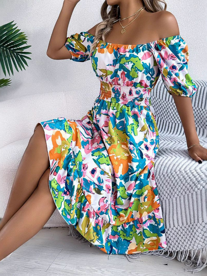 Sleeveless gradient dress displayed on a female model in a studio setting with plain backdrop.