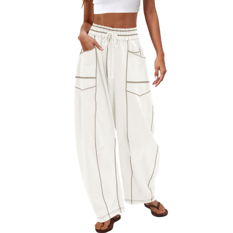 Female model showcasing relaxed cargo pants with a drawstring waist.