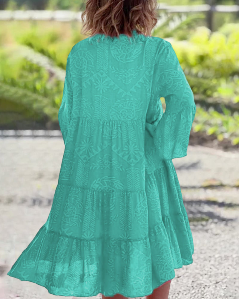 Woman showcasing a flowy casual dress with soft drape on a plain background, back angle