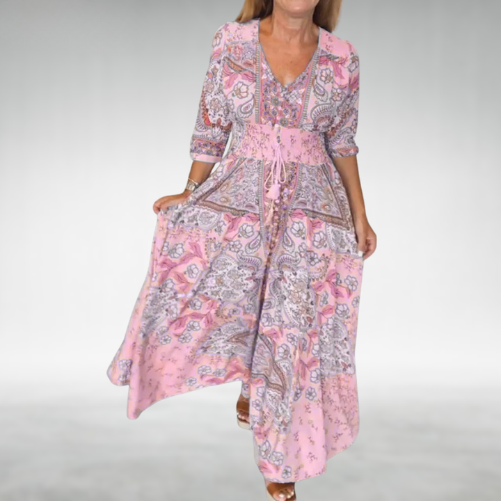 Feminine maxi dress featuring soft drape and graceful everyday style.