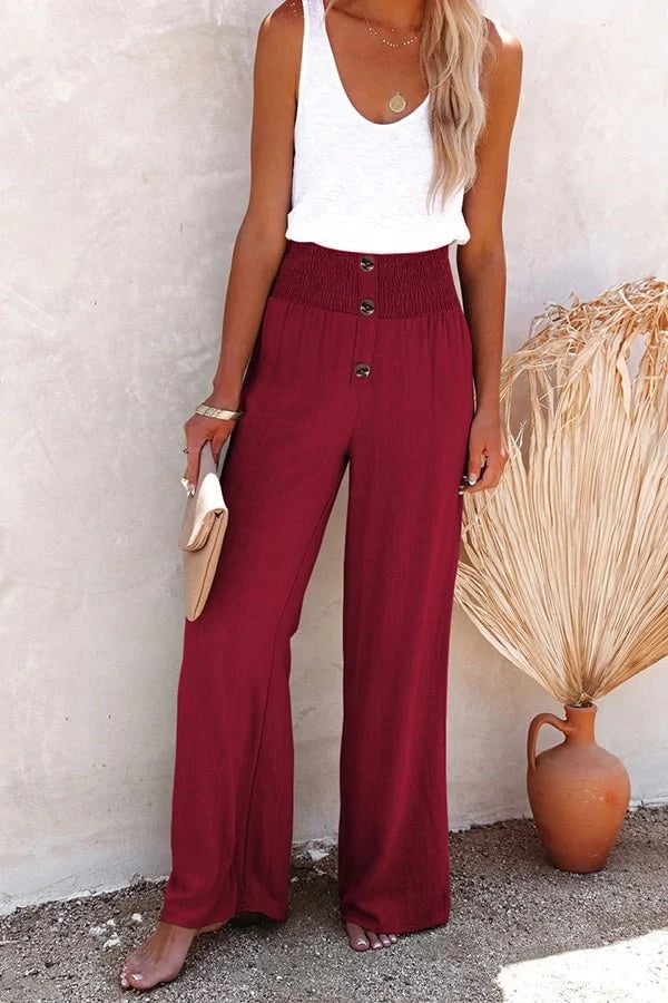 High-waisted women’s trousers displayed on a clean plain background.