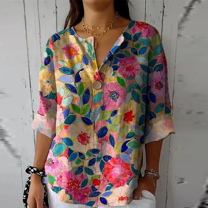 Soft printed blouse with model on a clean background, showing relaxed fit.