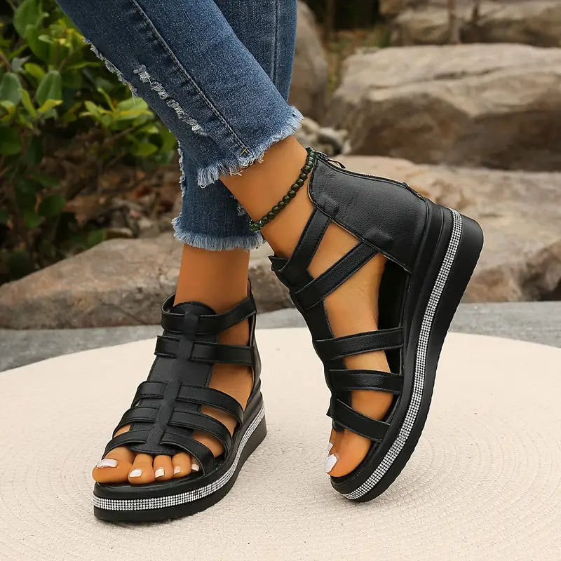 Female feet shown in supportive summer sandals on a plain background.
