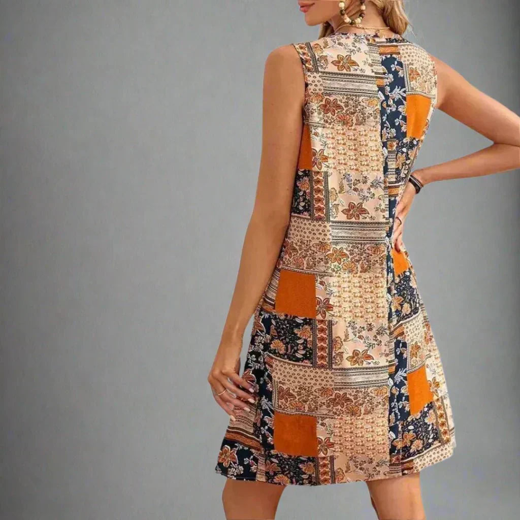 Women’s boho mini dress with scoop neckline and colorful patchwork design.