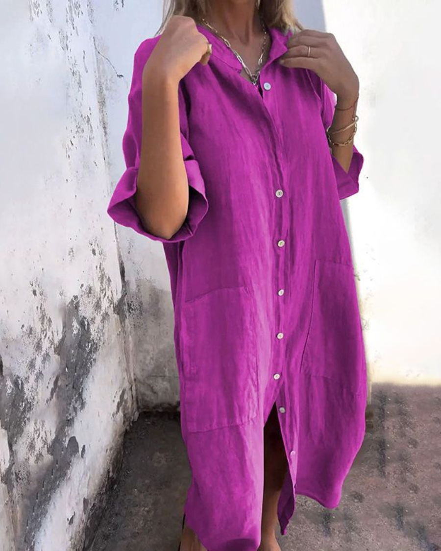 Elegant boho-inspired dress shown with a model on a clean background.