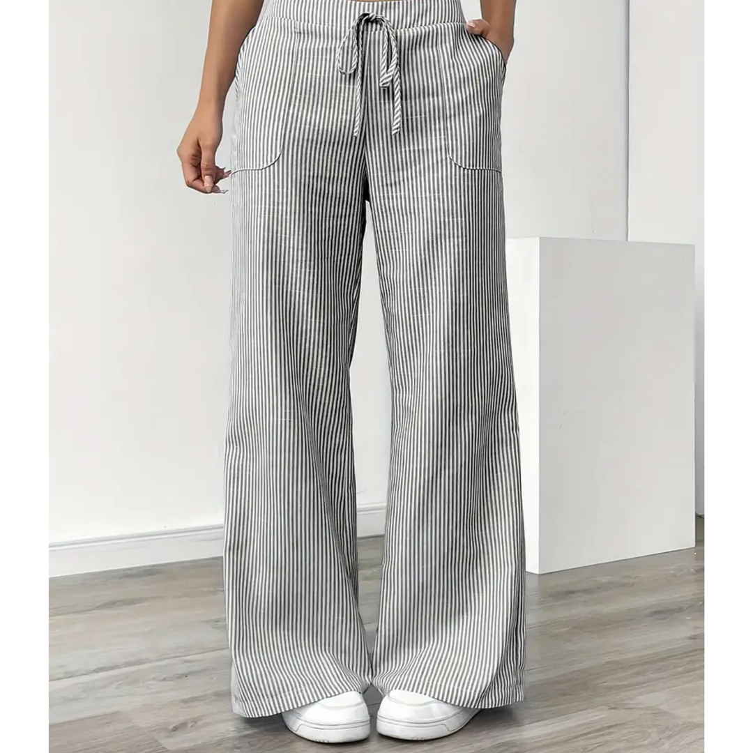 Casual striped pants with soft waistband and pockets on a plain background.