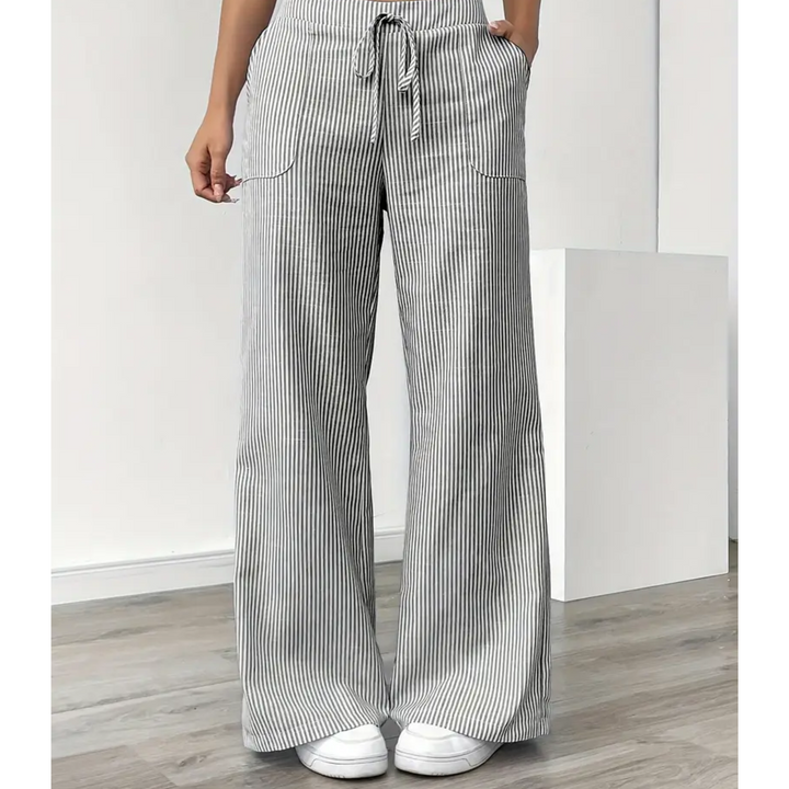 Casual striped pants with soft waistband and pockets on a plain background.