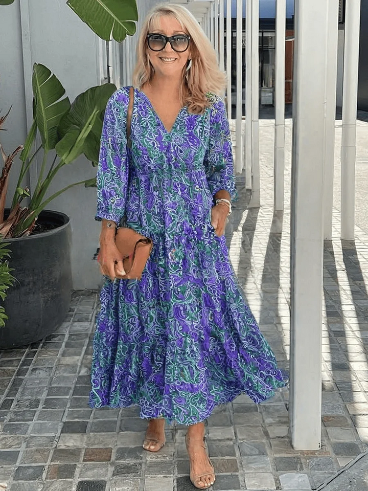 Lightweight floral boho dress with loose sleeves on a outdoor setting