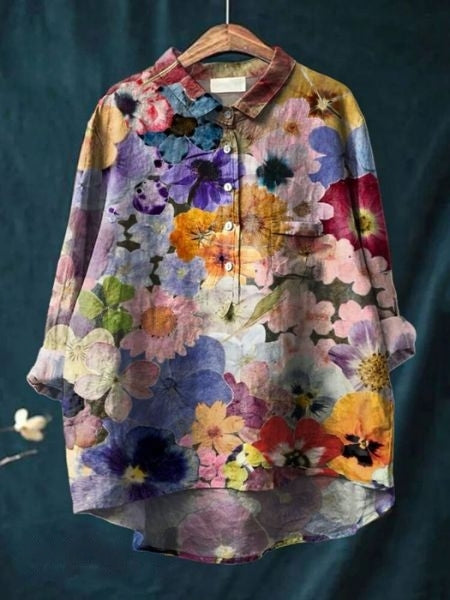 Lightweight floral blouse with a plain background.