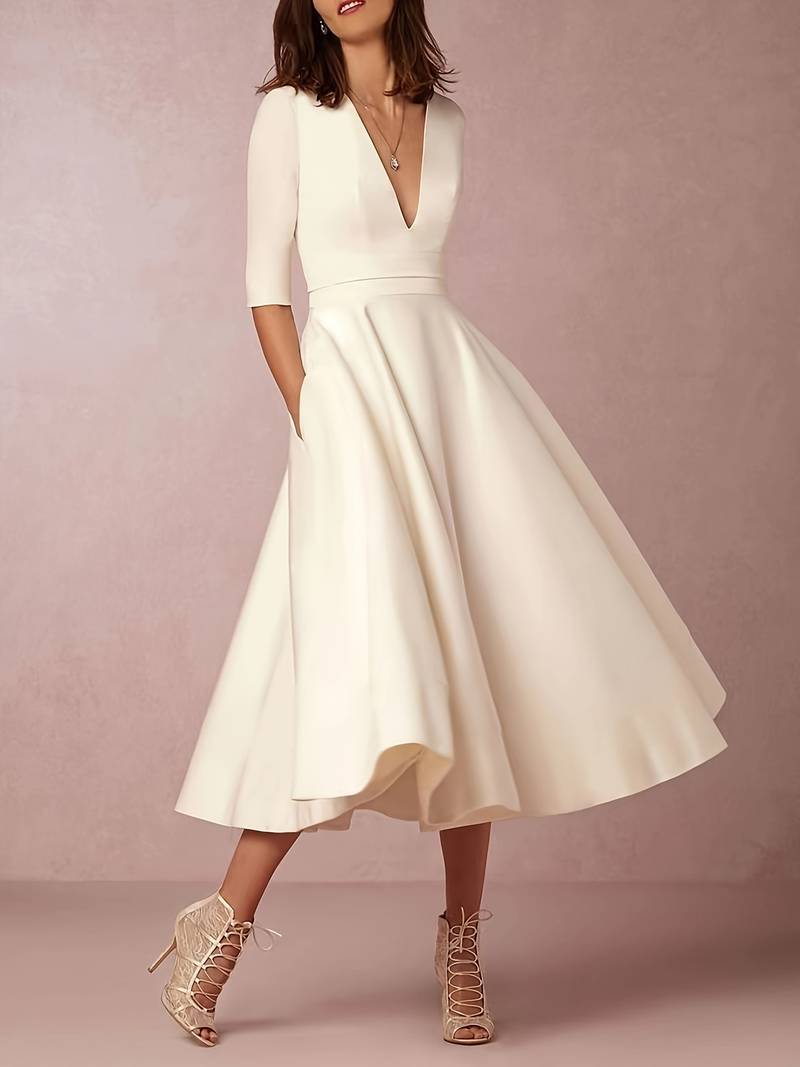 Woman posing front angle flowing midi dress in cozy living room