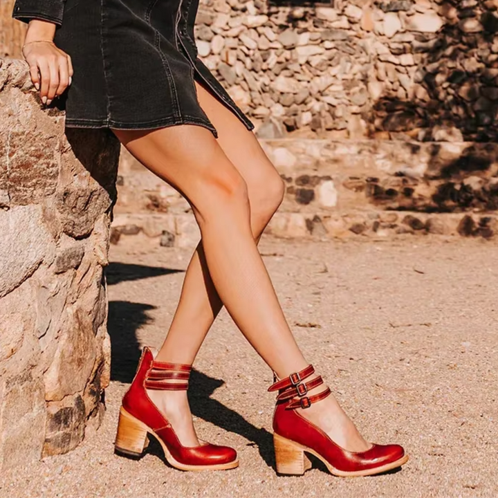 Female foot in refined everyday sandal against a clean background.