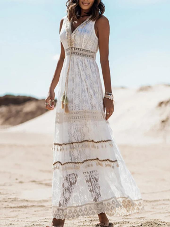 Woman showcasing a vintage-style printed dress with elegant movement on a plain backdrop.
