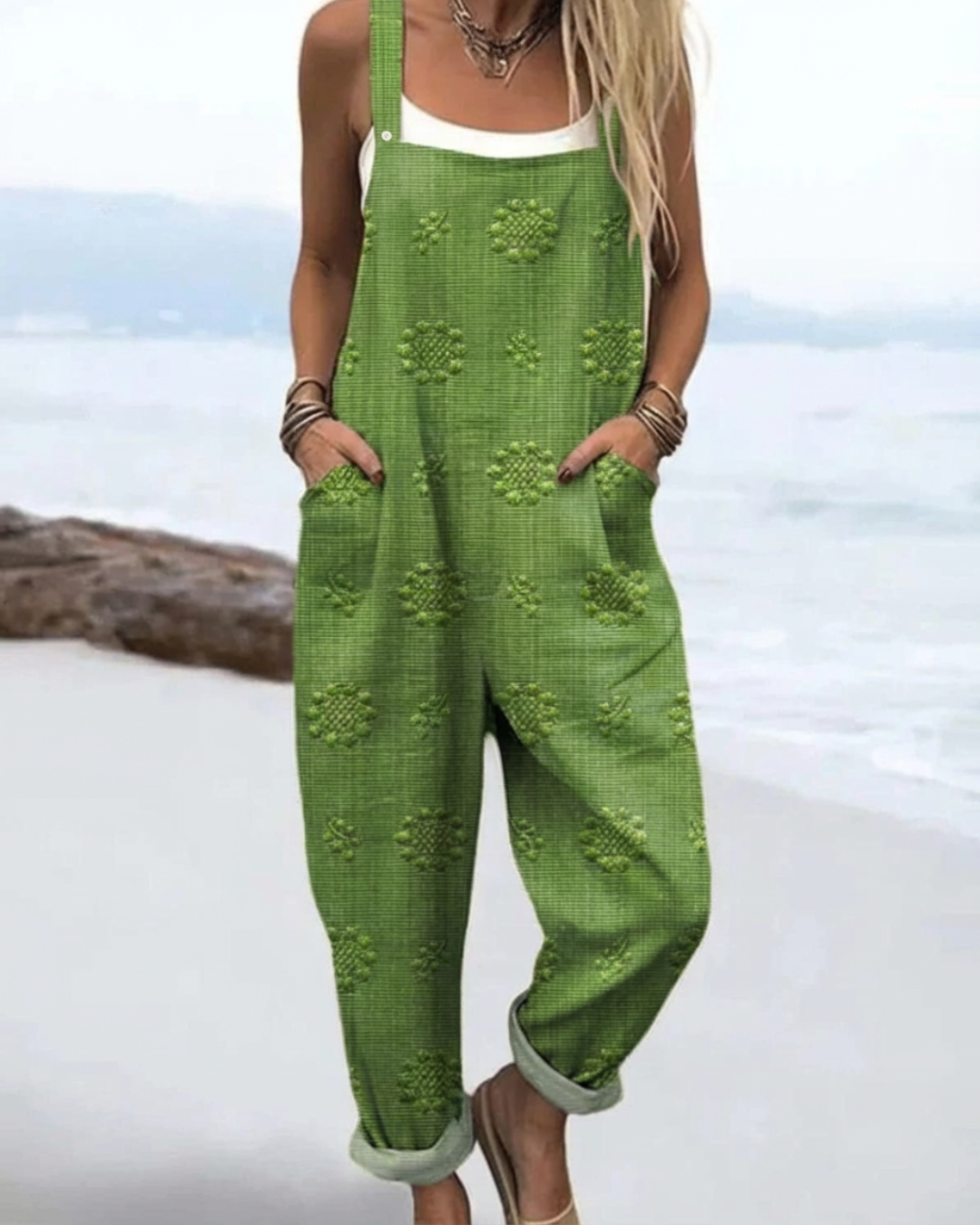 Woman wearing a relaxed-fit floraljumpsuit with soft fabric and wide legs.