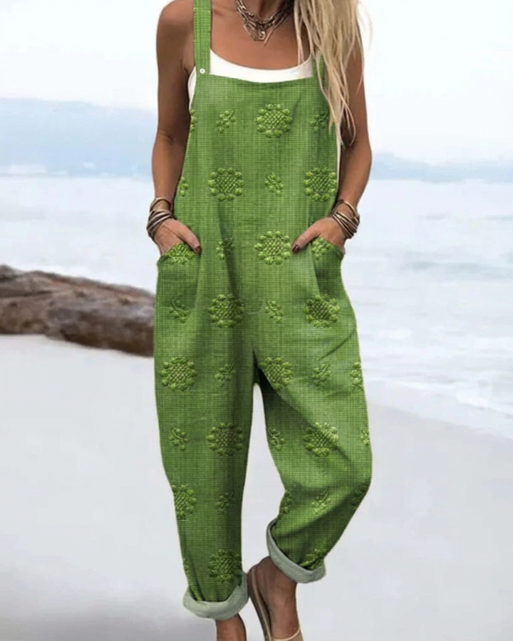 Woman wearing a relaxed-fit floraljumpsuit with soft fabric and wide legs.